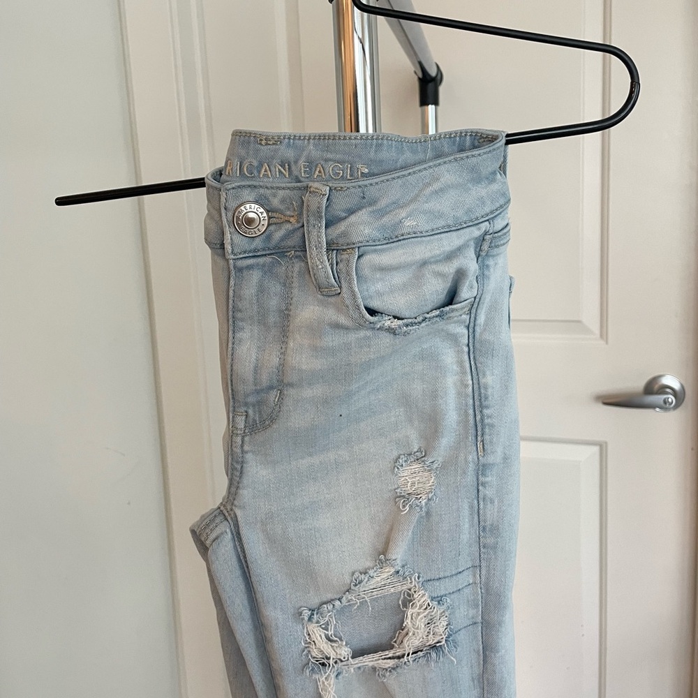 Light washed, American Eagle Next Level Stretch distressed, jeans